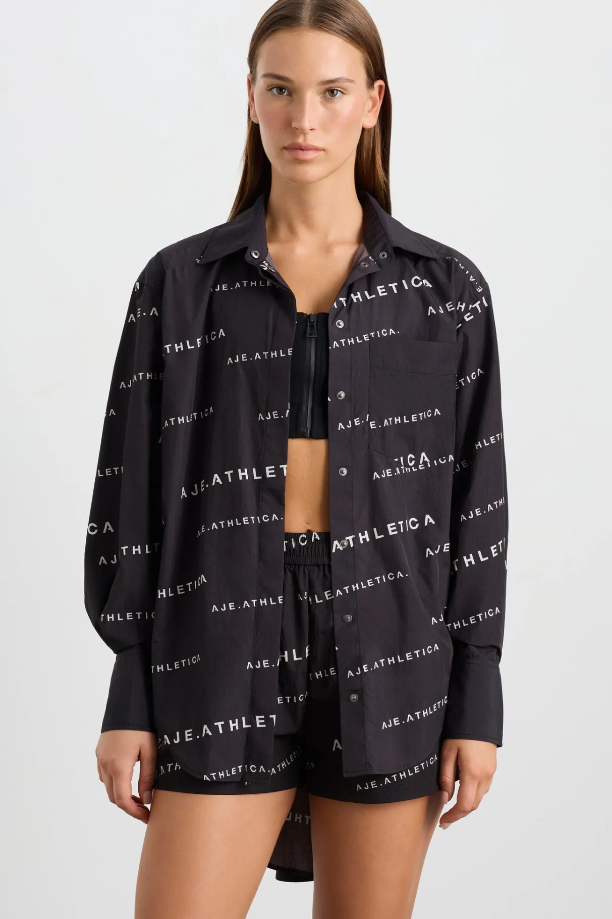 all_over_logo_spray_shirt__0.webp Discount Aje ATHLETICA All Over Logo Spray Shirt 406 Black/White