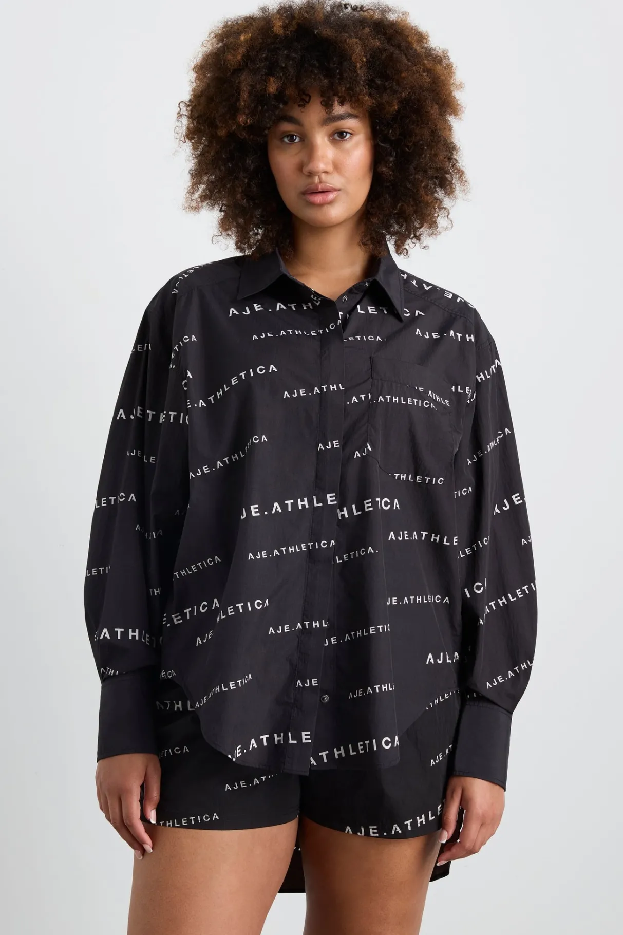 all_over_logo_spray_shirt__10.webp Discount Aje ATHLETICA All Over Logo Spray Shirt 406 Black/White