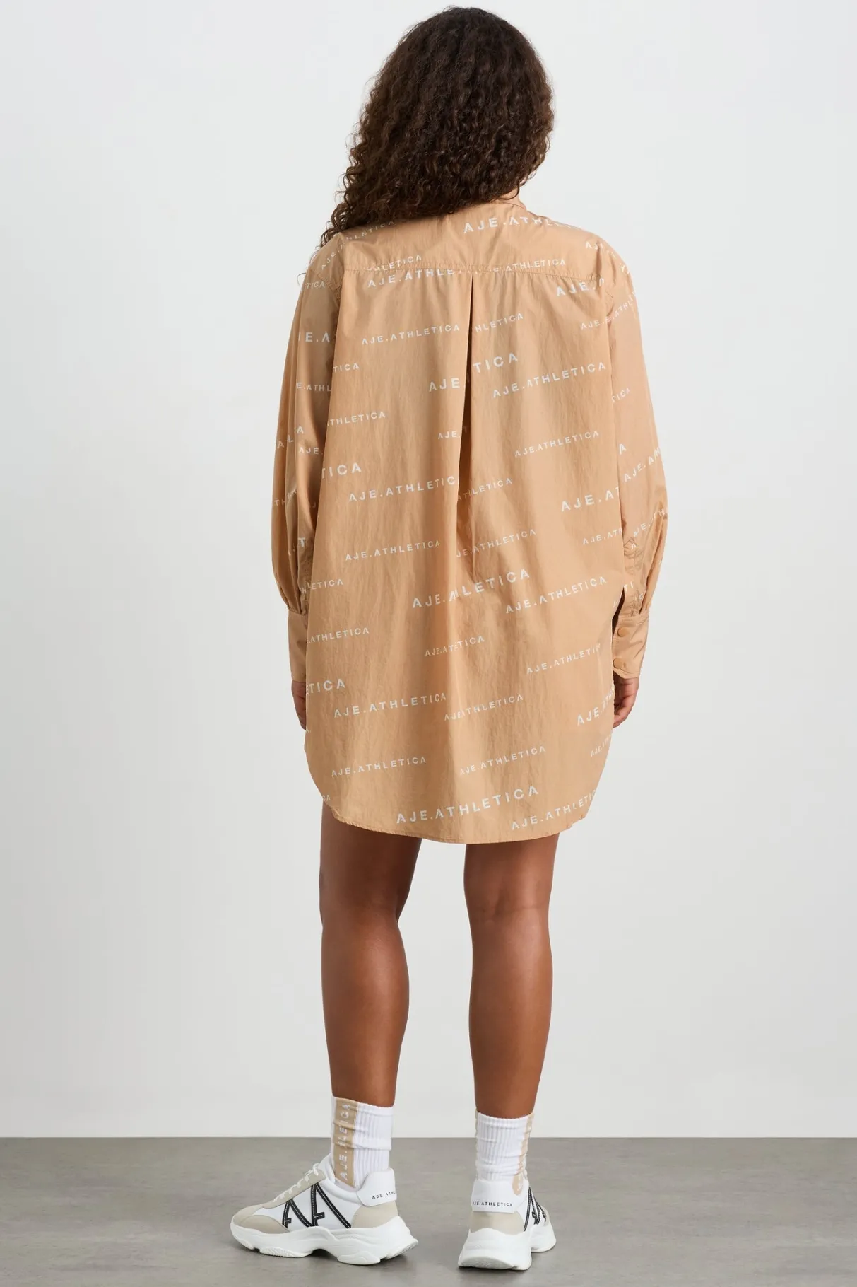 all_over_logo_spray_shirt__11-1.webp Shop Aje ATHLETICA All Over Logo Spray Shirt 406 Natural Tan / White