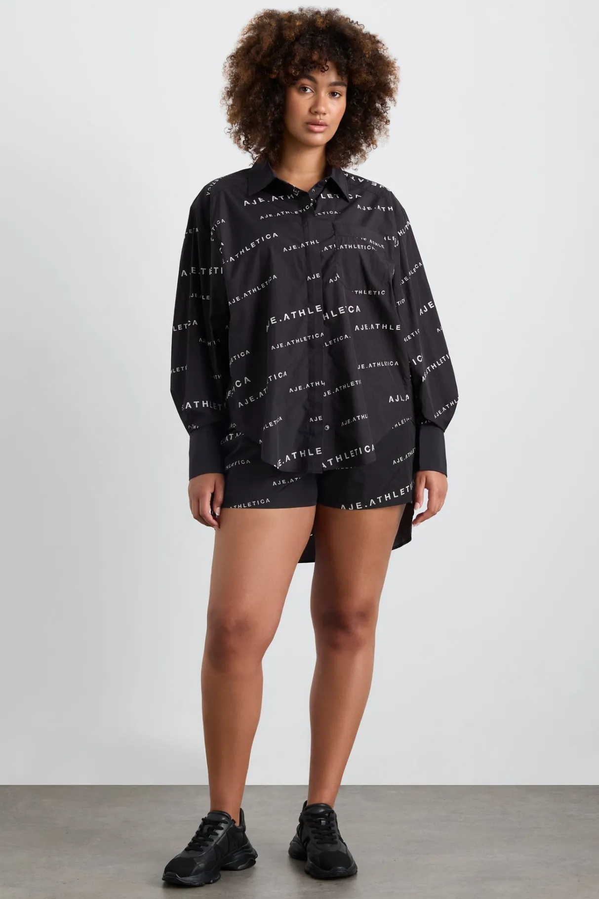 all_over_logo_spray_shirt__11.webp Discount Aje ATHLETICA All Over Logo Spray Shirt 406 Black/White