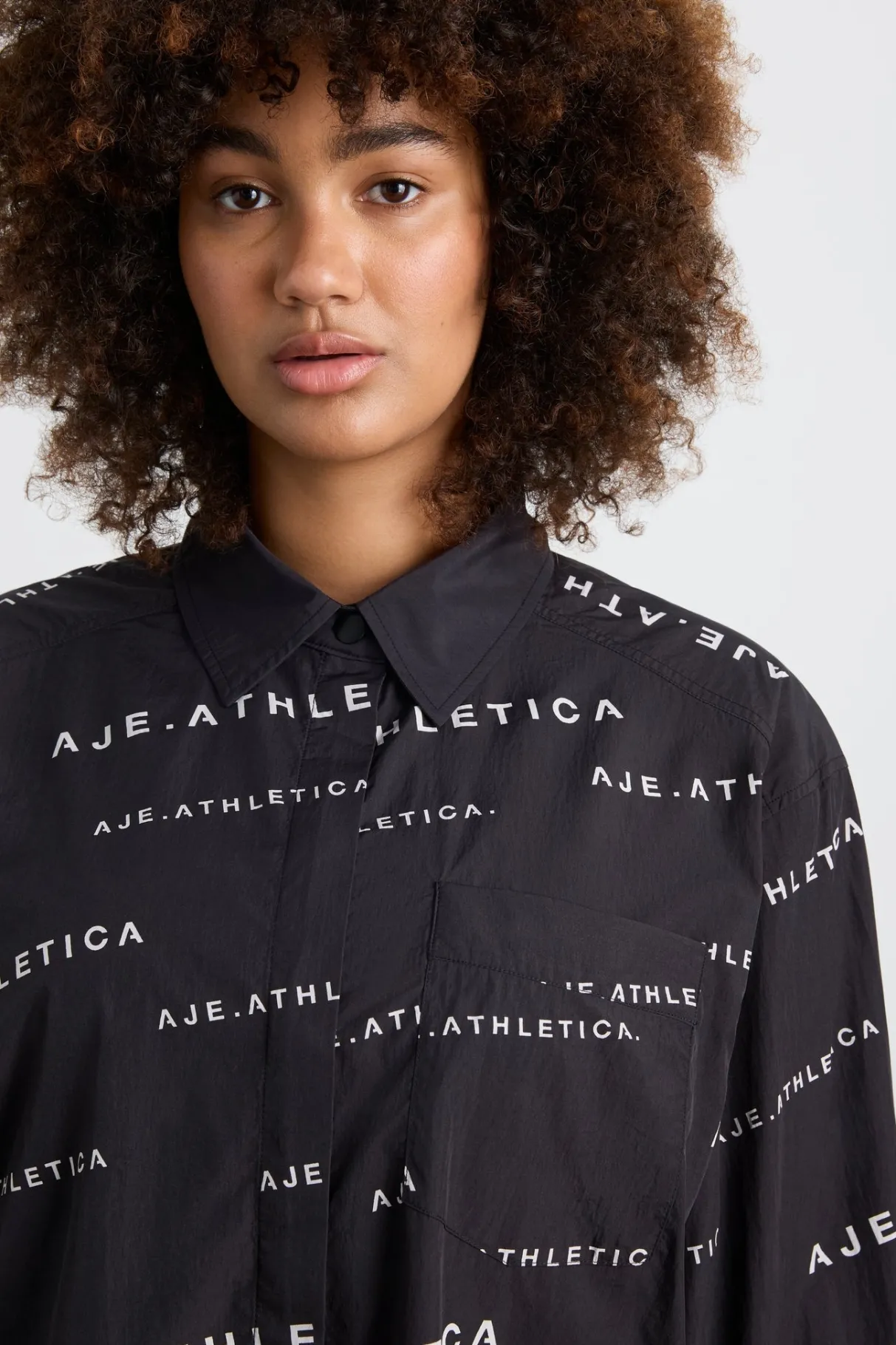all_over_logo_spray_shirt__12.webp Discount Aje ATHLETICA All Over Logo Spray Shirt 406 Black/White