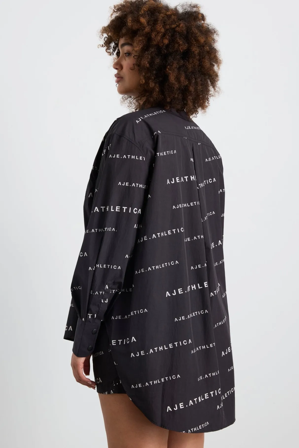 all_over_logo_spray_shirt__13.webp Discount Aje ATHLETICA All Over Logo Spray Shirt 406 Black/White