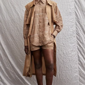 Shop Aje ATHLETICA All Over Logo Spray Shirt 406 Natural Tan / White