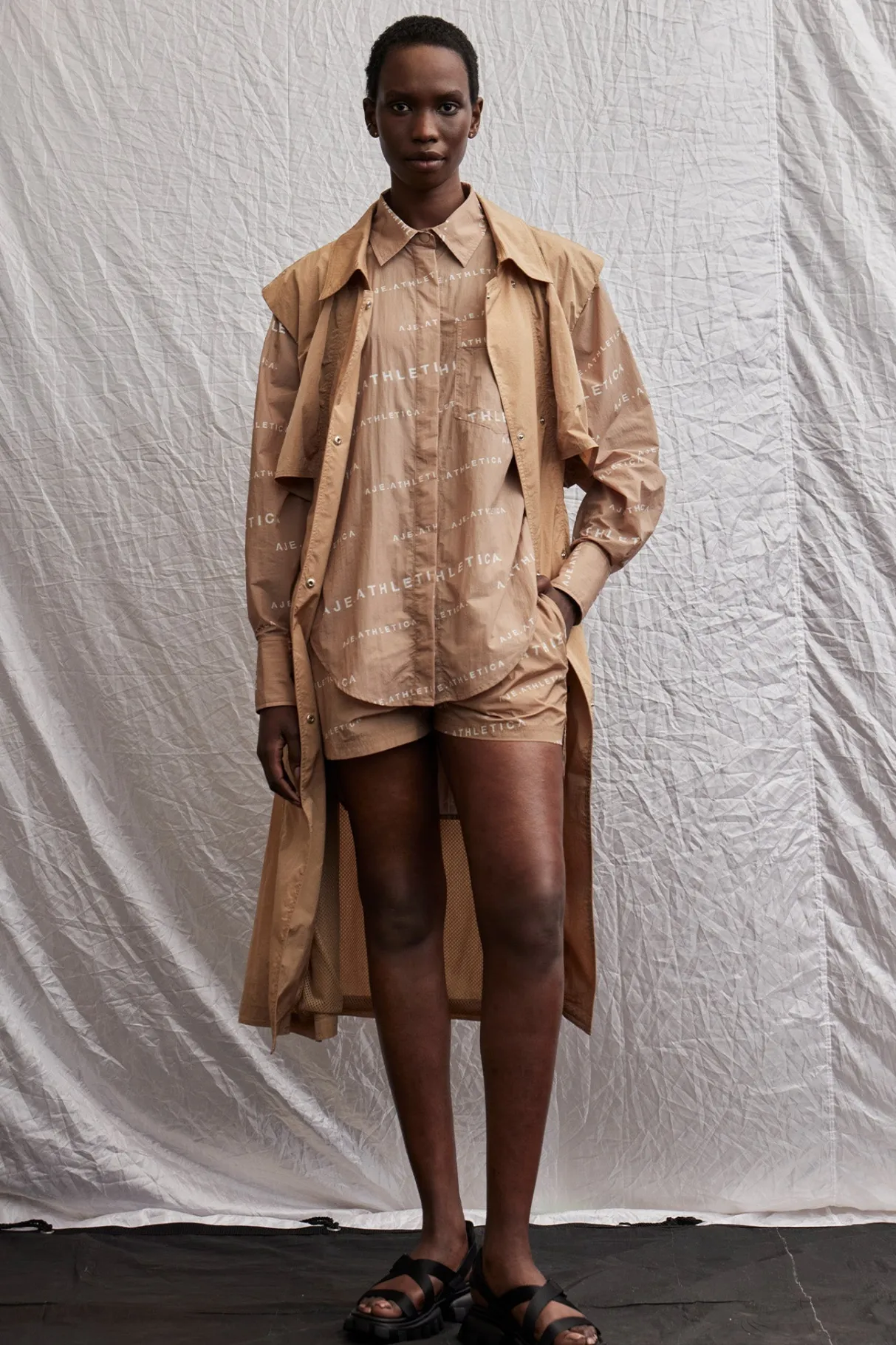 all_over_logo_spray_shirt__19.webp Shop Aje ATHLETICA All Over Logo Spray Shirt 406 Natural Tan / White