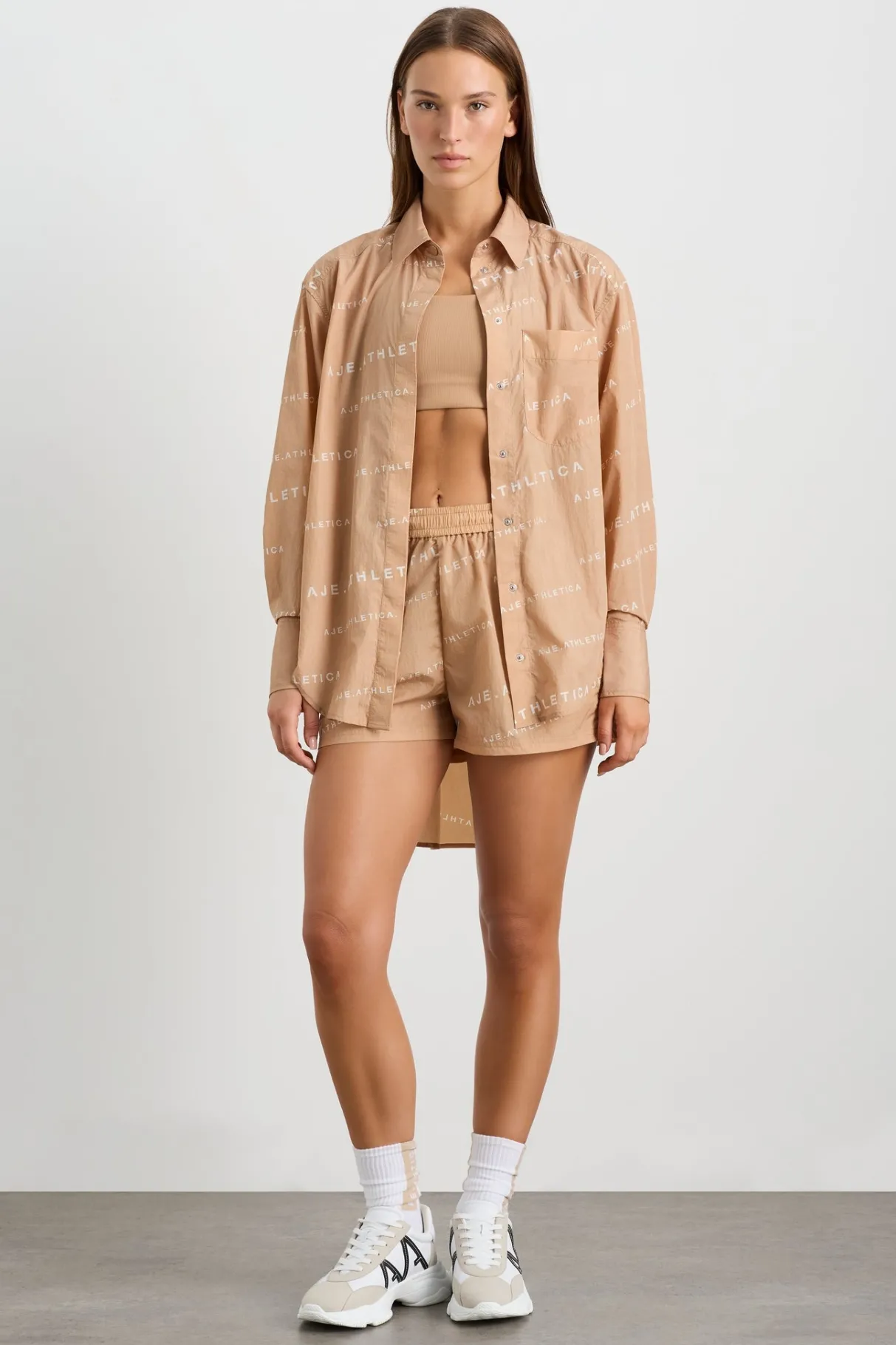 all_over_logo_spray_shirt__3-1.webp Shop Aje ATHLETICA All Over Logo Spray Shirt 406 Natural Tan / White