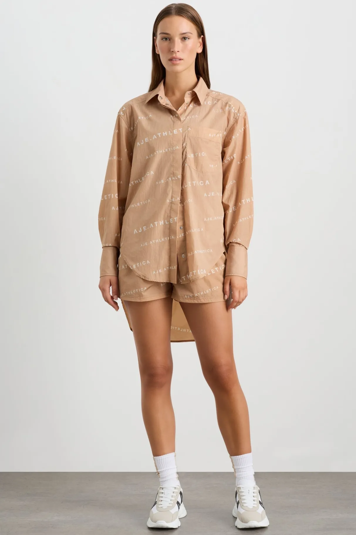 all_over_logo_spray_shirt__4-1.webp Shop Aje ATHLETICA All Over Logo Spray Shirt 406 Natural Tan / White