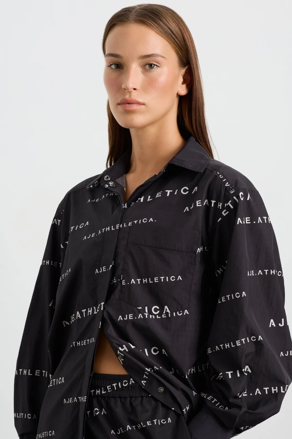 all_over_logo_spray_shirt__4.webp Discount Aje ATHLETICA All Over Logo Spray Shirt 406 Black/White