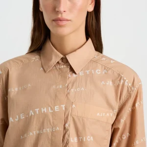 Shop Aje ATHLETICA All Over Logo Spray Shirt 406 Natural Tan / White