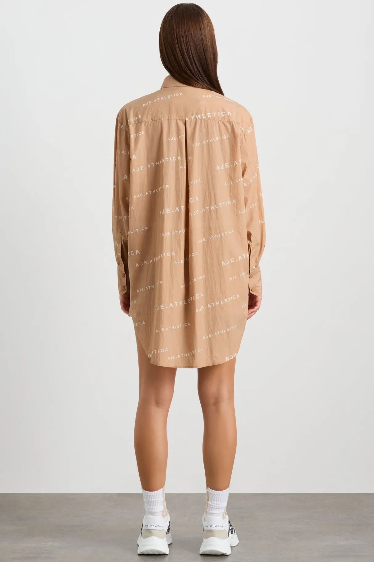all_over_logo_spray_shirt__6-1.webp Shop Aje ATHLETICA All Over Logo Spray Shirt 406 Natural Tan / White