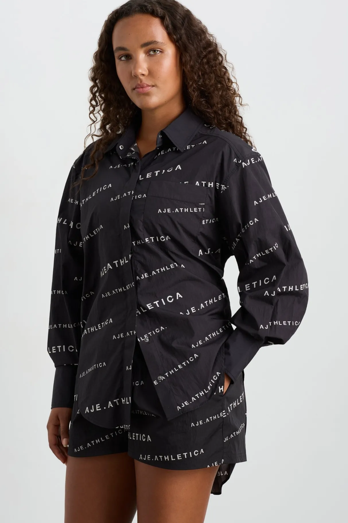 all_over_logo_spray_shirt__6.webp Discount Aje ATHLETICA All Over Logo Spray Shirt 406 Black/White