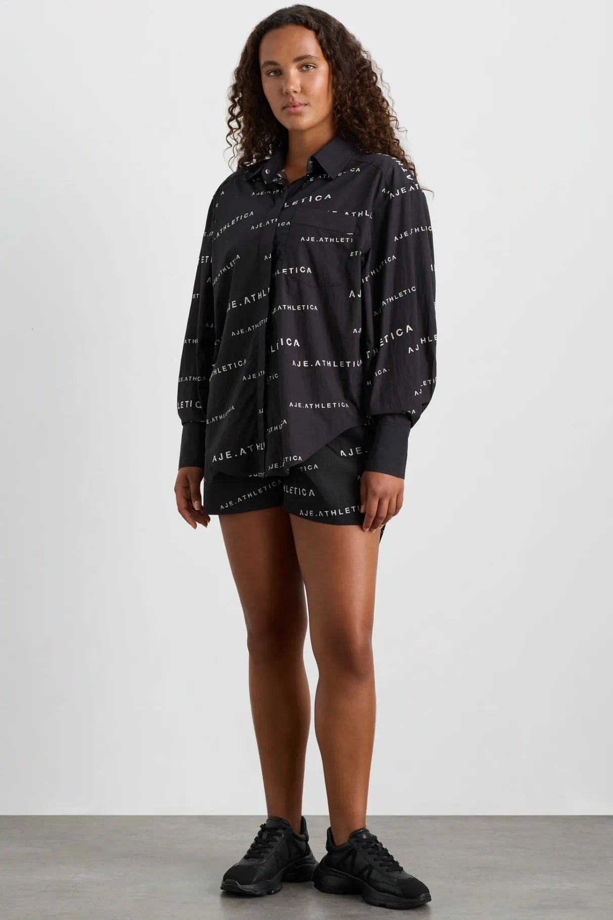 all_over_logo_spray_shirt__7.webp Discount Aje ATHLETICA All Over Logo Spray Shirt 406 Black/White