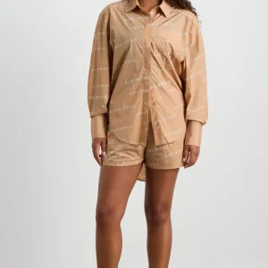 Shop Aje ATHLETICA All Over Logo Spray Shirt 406 Natural Tan / White