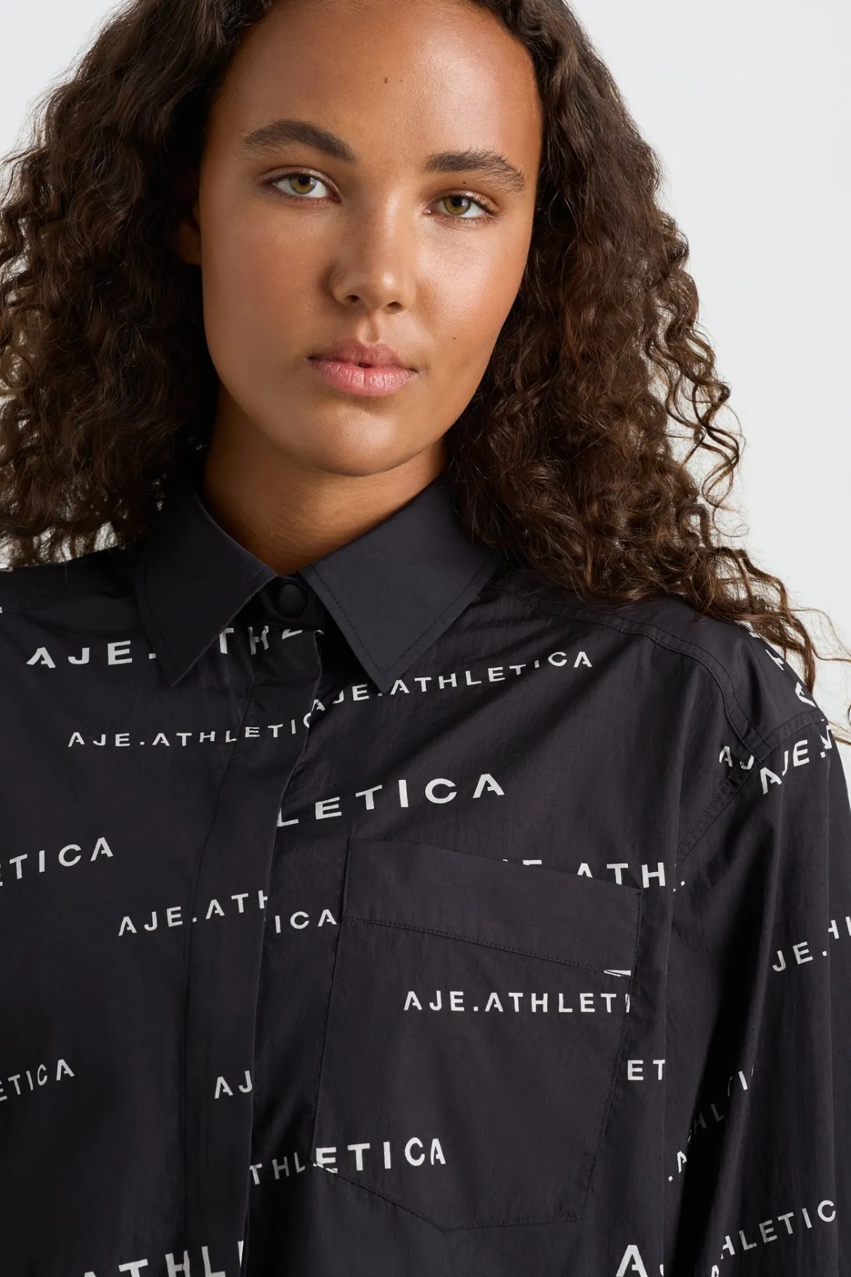 all_over_logo_spray_shirt__8.webp Discount Aje ATHLETICA All Over Logo Spray Shirt 406 Black/White