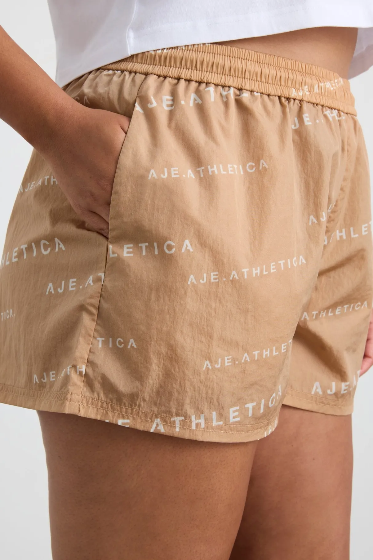 all_over_logo_spray_short__11.webp Cheap Aje ATHLETICA All Over Logo Spray Short 616 Natural Tan / White