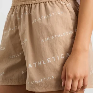Cheap Aje ATHLETICA All Over Logo Spray Short 616 Natural Tan / White