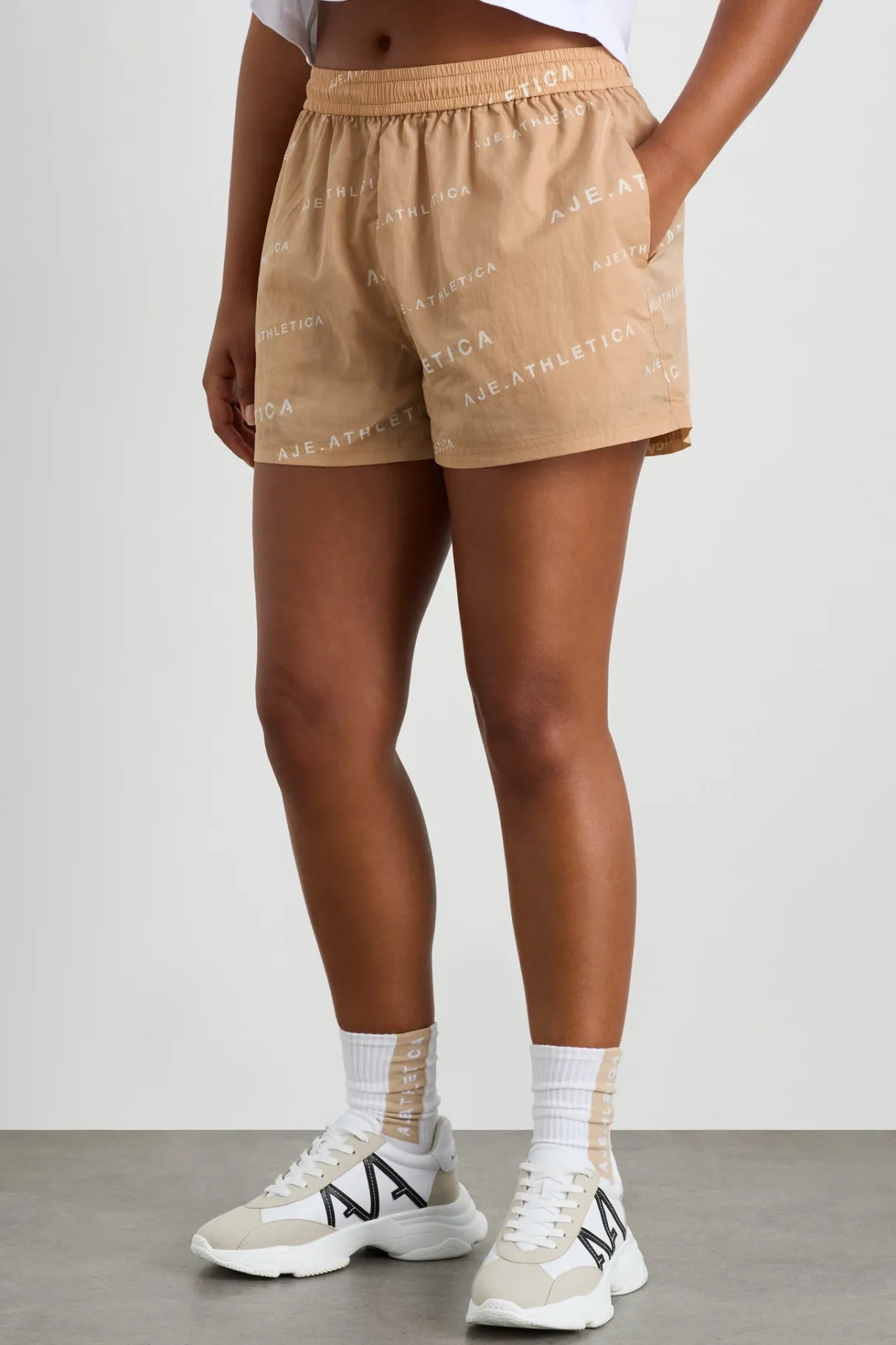 all_over_logo_spray_short__6.webp Cheap Aje ATHLETICA All Over Logo Spray Short 616 Natural Tan / White