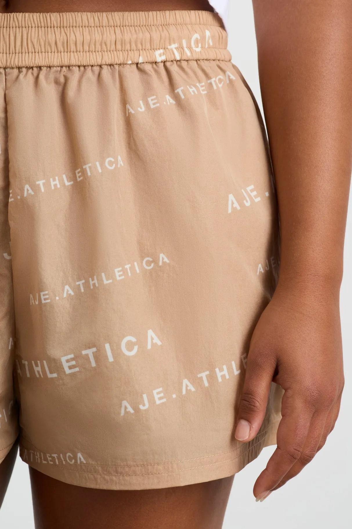 all_over_logo_spray_short__7.webp Cheap Aje ATHLETICA All Over Logo Spray Short 616 Natural Tan / White