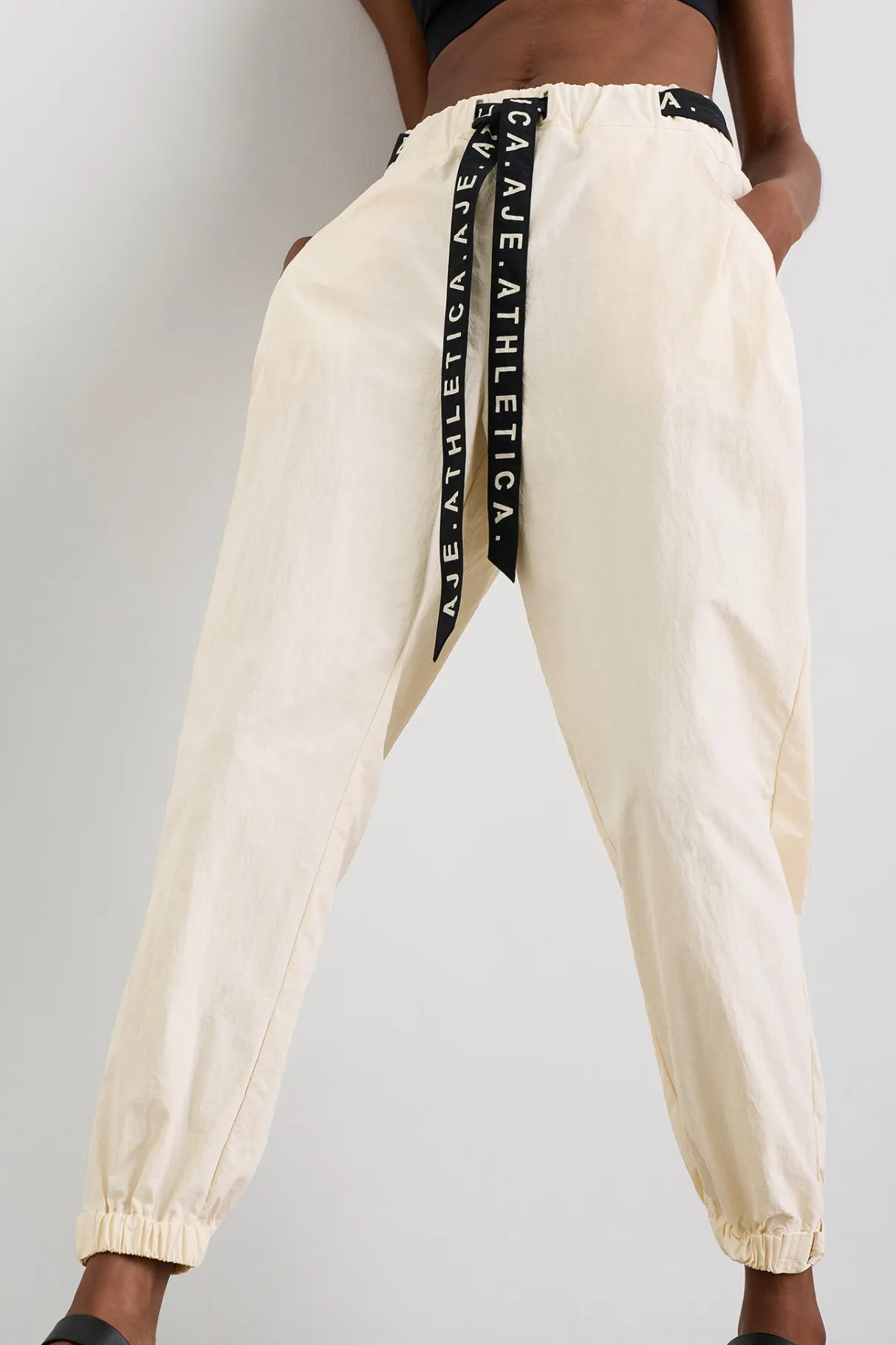 belted_windbreak_pant__4-2.webp Shop Aje ATHLETICA Belted Windbreak Pant 502 Limestone Beige Black