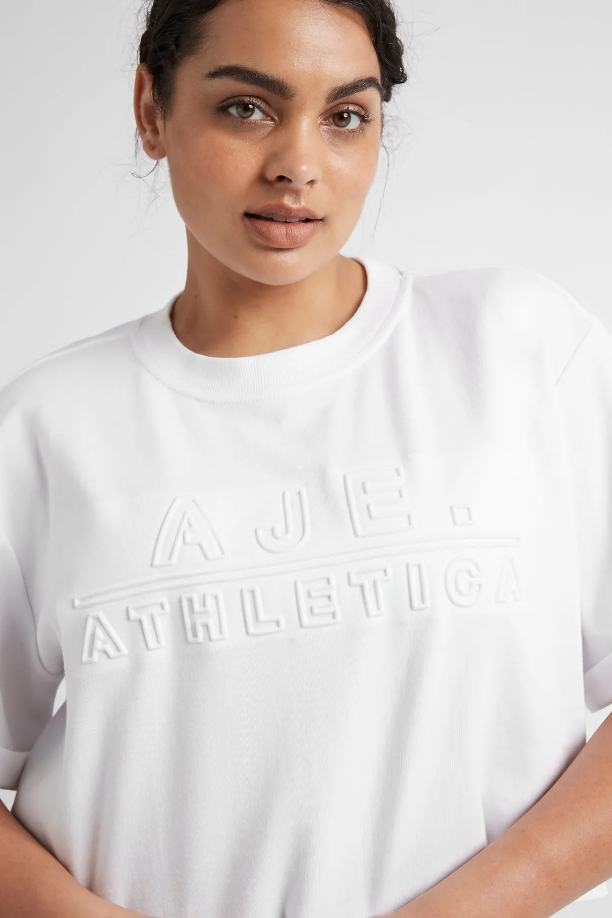 cropped_embossed_classic_logo_tshirt__14.webp Hot Aje ATHLETICA Cropped Embossed Classic Logo T-Shirt 105 White