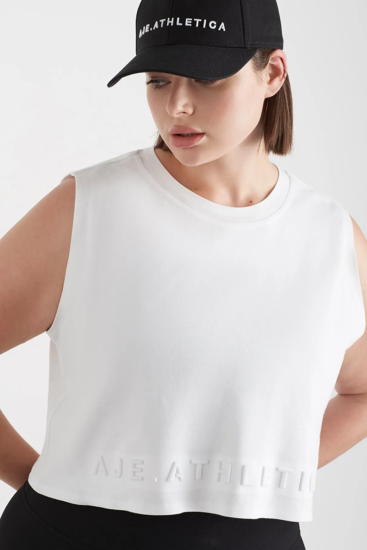 cropped_embossed_signature_logo_tank__11-3.webp Shop Aje ATHLETICA Cropped Embossed Signature Logo Tank 106 White