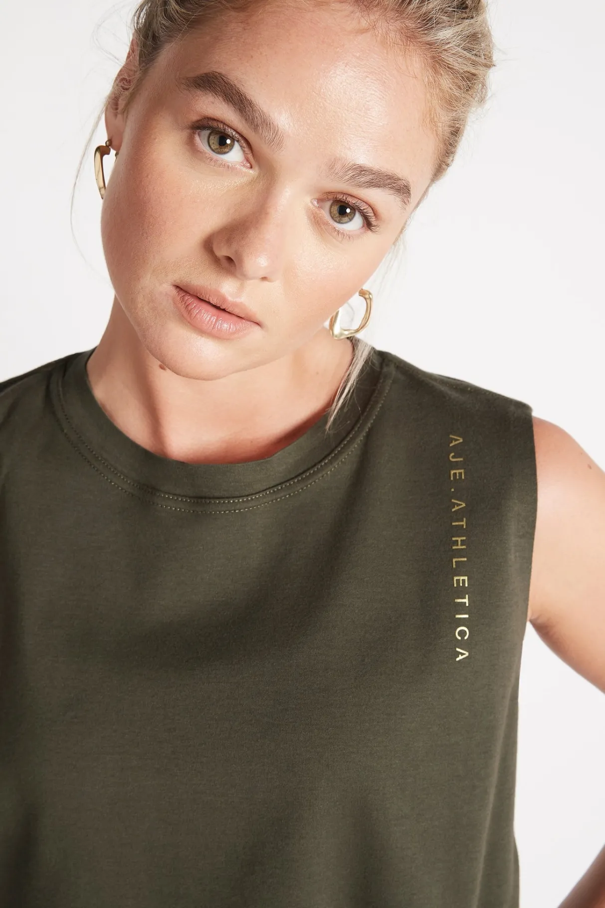 cropped_embossed_signature_logo_tank__3-4.webp Best Aje ATHLETICA Cropped Embossed Signature Logo Tank 112 Forest Green
