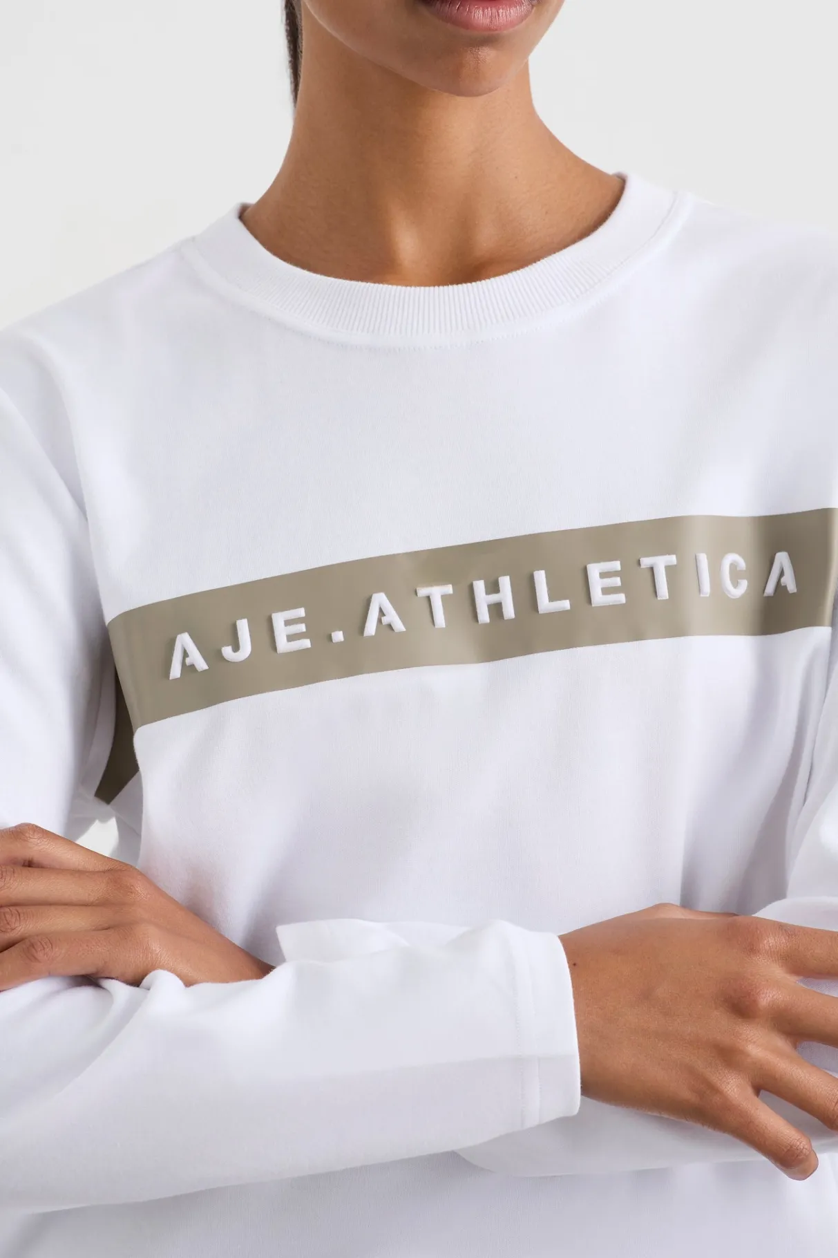 embossed_logo_long_sleeve_tshirt__3.webp Shop Aje ATHLETICA Embossed Logo Long Sleeve T-Shirt 127 White Soft Khaki