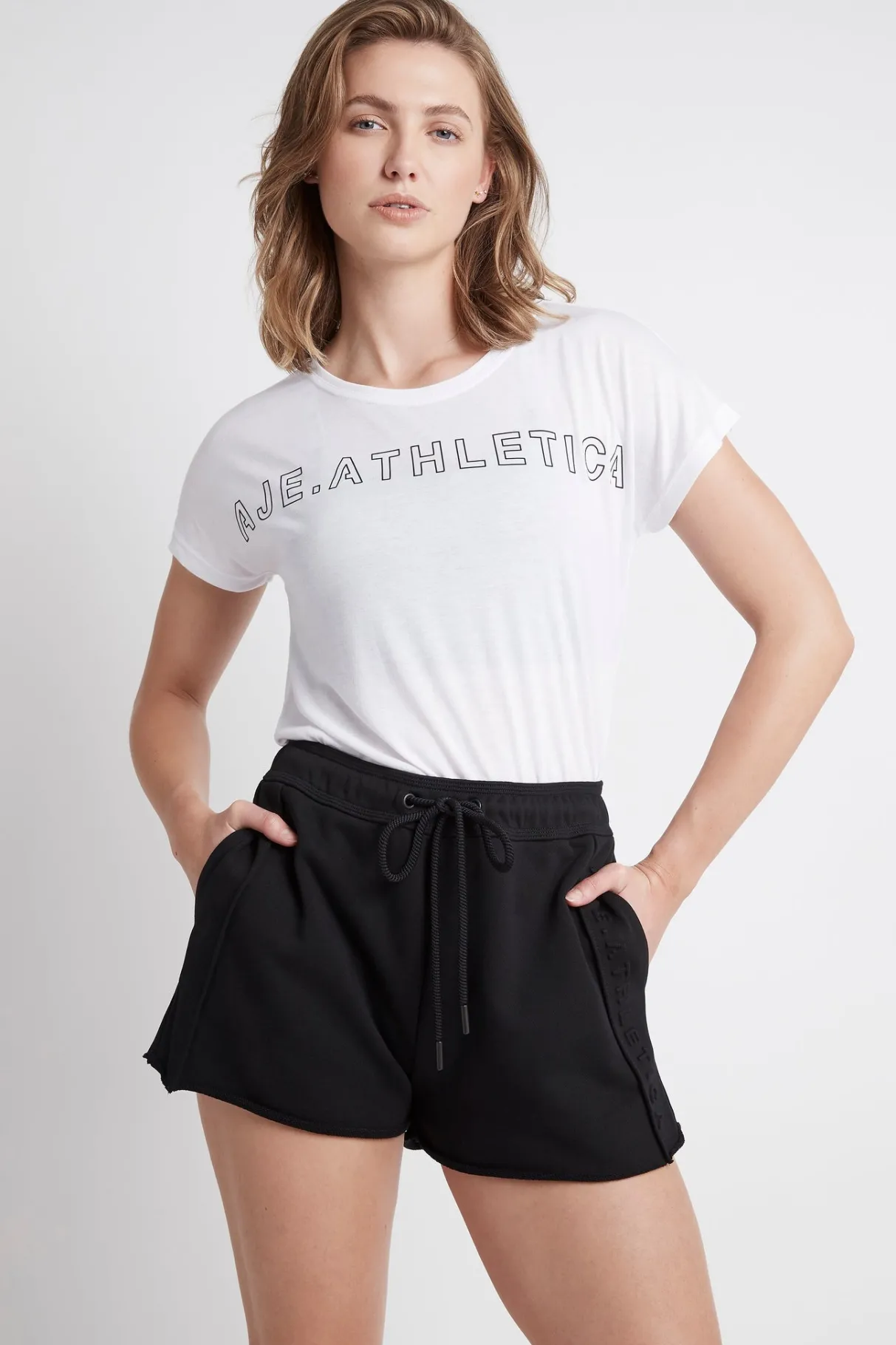 embossed_signature_logo_training_tshirt__0-1.webp Fashion Aje ATHLETICA Embossed Signature Logo Training T-Shirt 110 White/Black