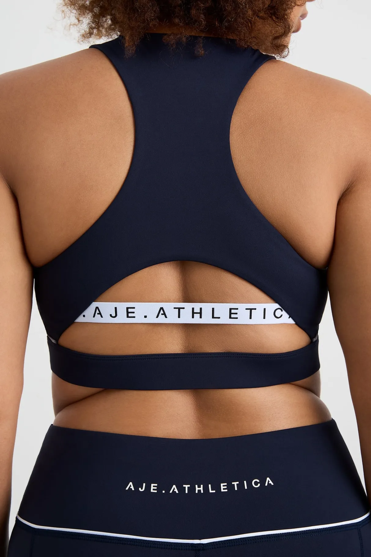 high_neck_sports_bra__11.webp Online Aje ATHLETICA High Neck Sports Bra 374 Galaxy Blue
