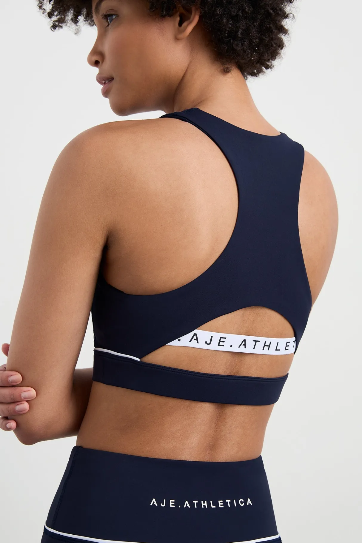 high_neck_sports_bra__3.webp Online Aje ATHLETICA High Neck Sports Bra 374 Galaxy Blue