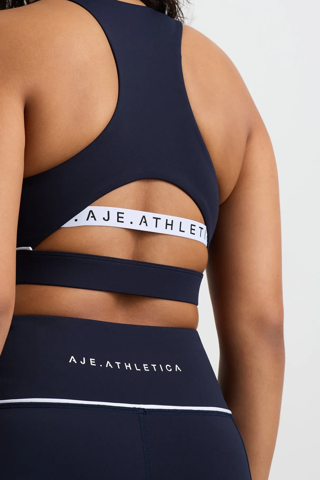 high_neck_sports_bra__7.webp Online Aje ATHLETICA High Neck Sports Bra 374 Galaxy Blue