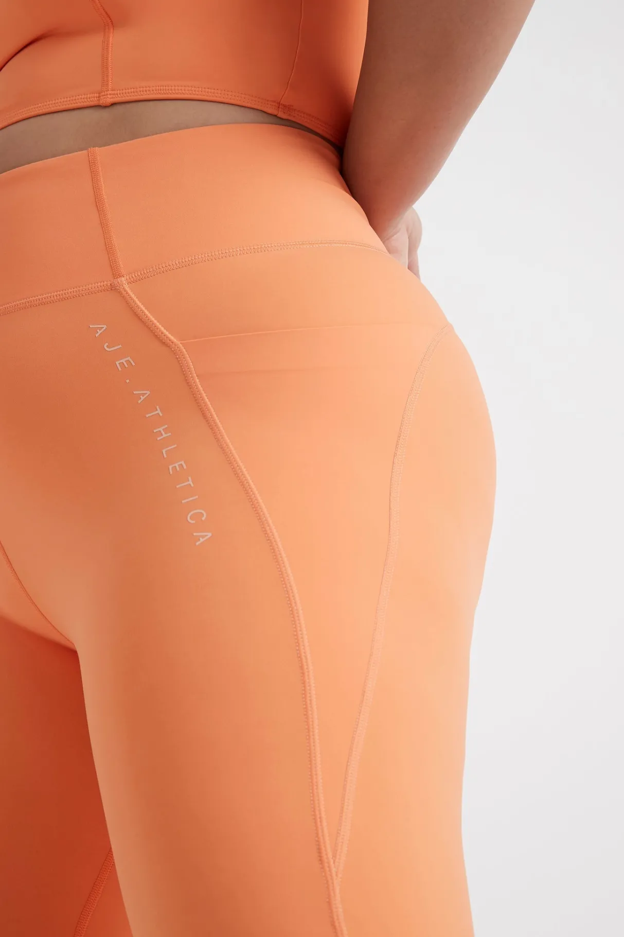 high_rise__logo_legging__11.webp Best Aje ATHLETICA High Rise 7/8 Logo Legging 203 Tangerine Orange-Sand