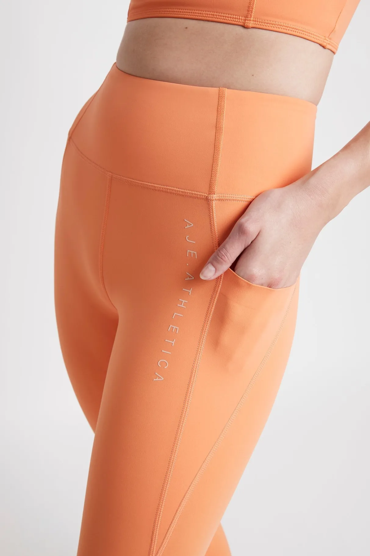high_rise__logo_legging__3.webp Best Aje ATHLETICA High Rise 7/8 Logo Legging 203 Tangerine Orange-Sand