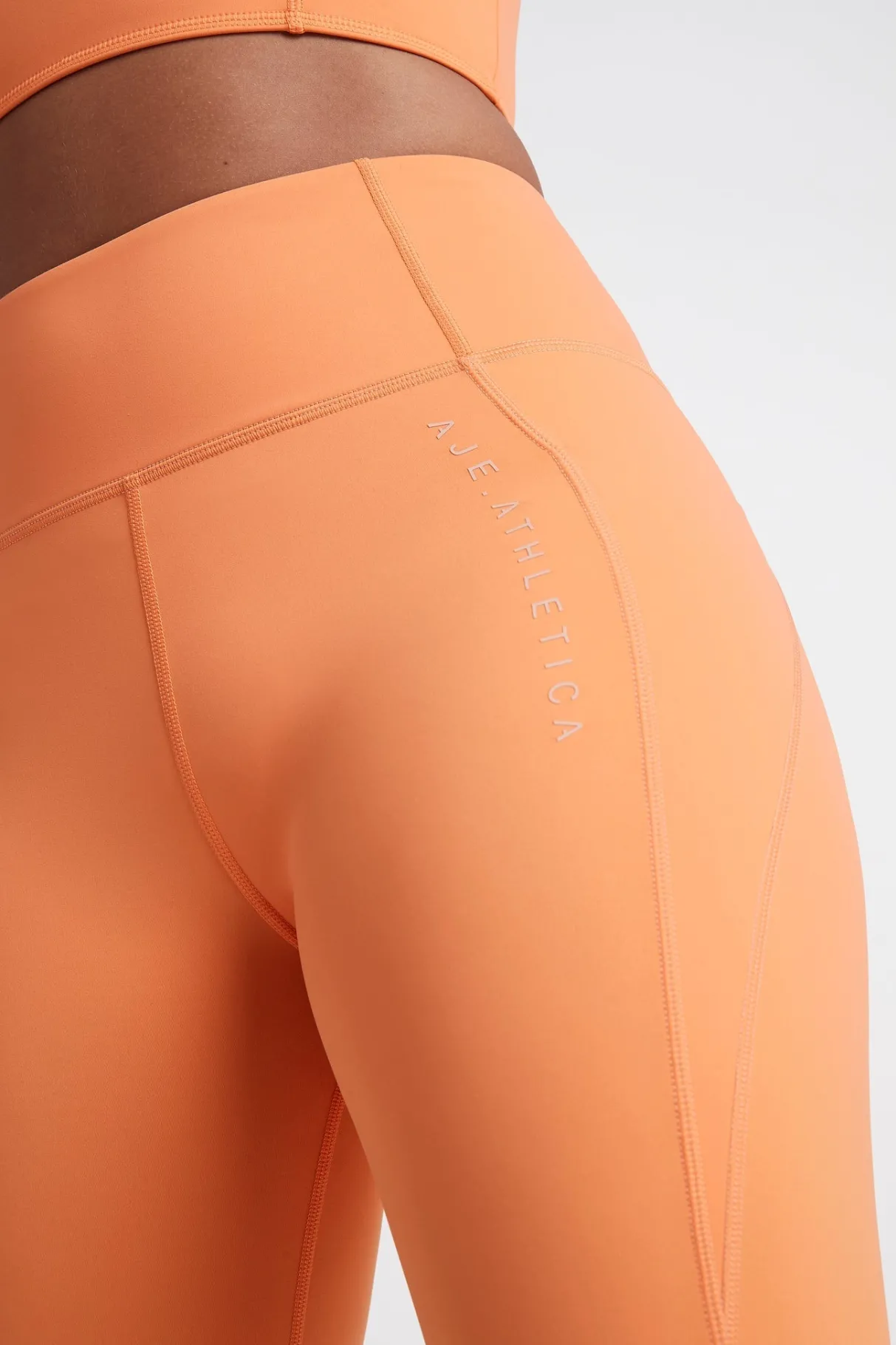 high_rise__logo_legging__7.webp Best Aje ATHLETICA High Rise 7/8 Logo Legging 203 Tangerine Orange-Sand
