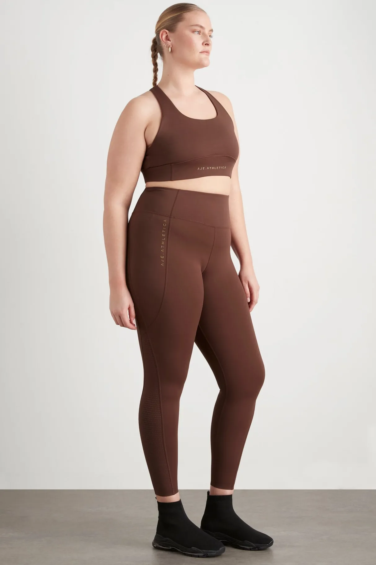high_rise_perforated_hem_full_length_legging__12.webp Best Aje ATHLETICA High Rise Perforated Hem Full Length Legging 227 Dark Chocolate