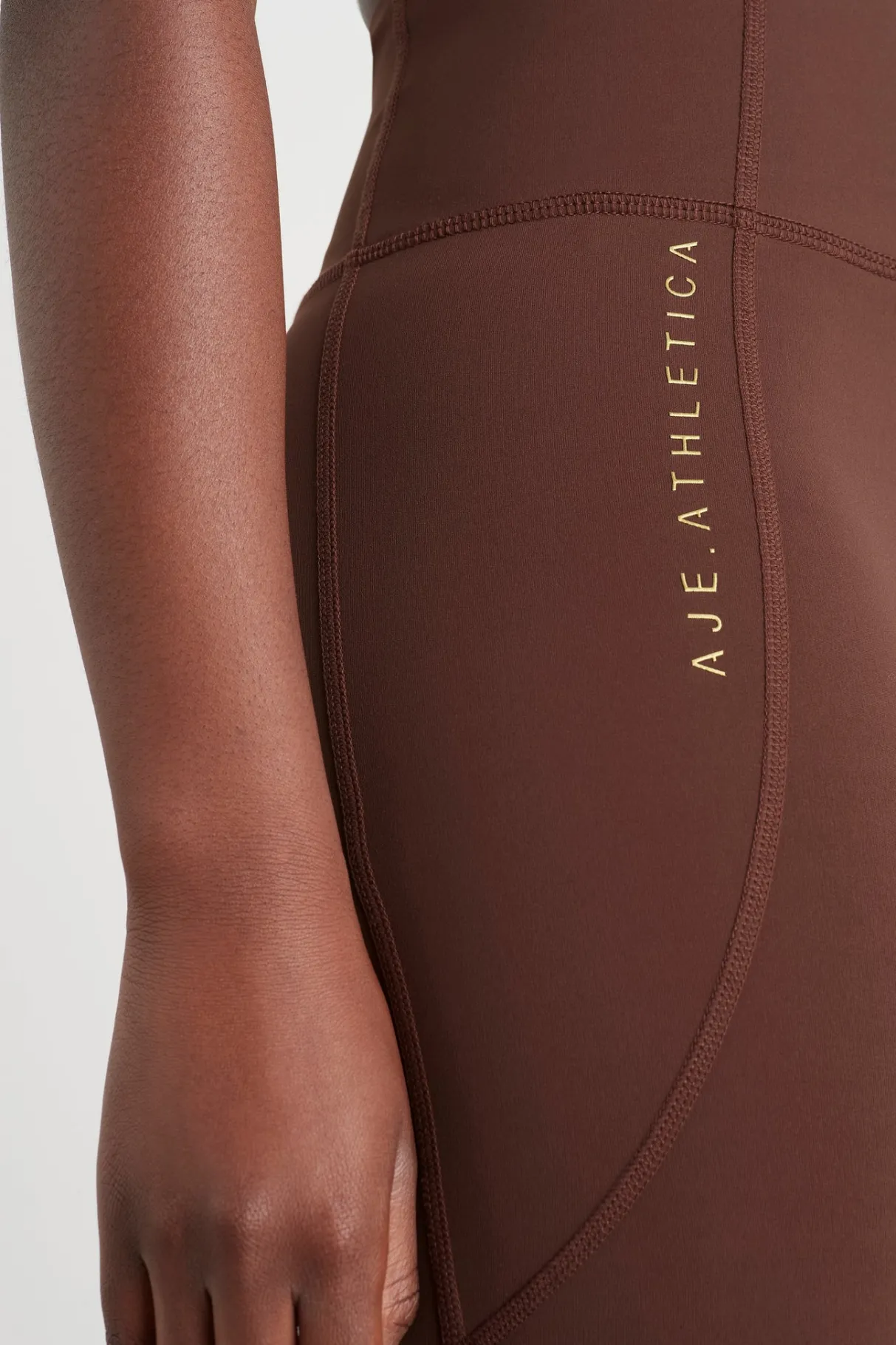 high_rise_perforated_hem_full_length_legging__4.webp Best Aje ATHLETICA High Rise Perforated Hem Full Length Legging 227 Dark Chocolate