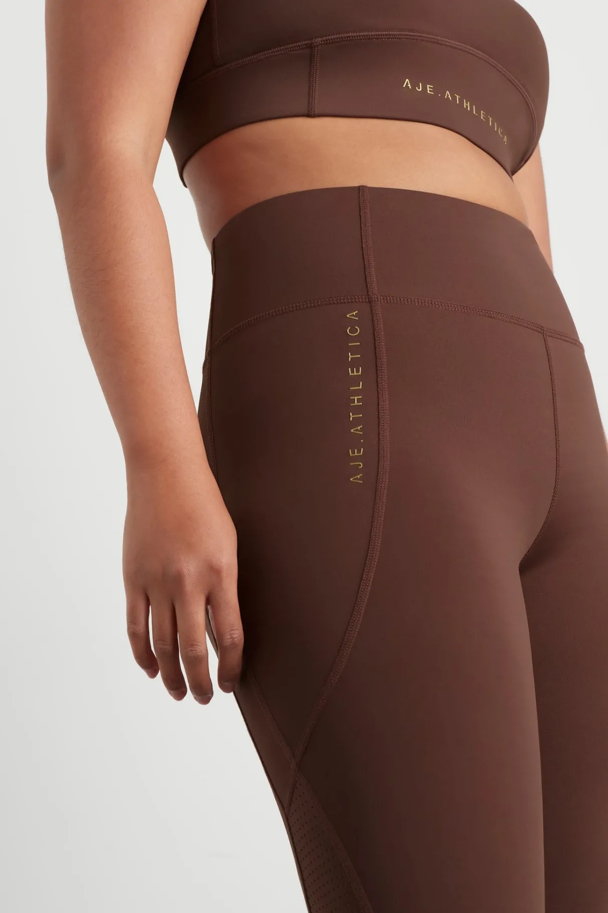 high_rise_perforated_hem_full_length_legging__8.webp Best Aje ATHLETICA High Rise Perforated Hem Full Length Legging 227 Dark Chocolate