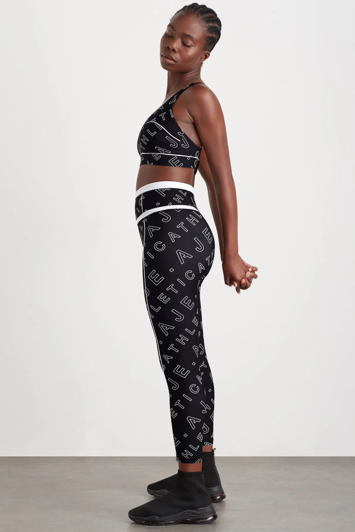high_rise_piping__legging__0.webp New Aje ATHLETICA High Rise Piping 7/8 Legging 230 Black Fineline Logo