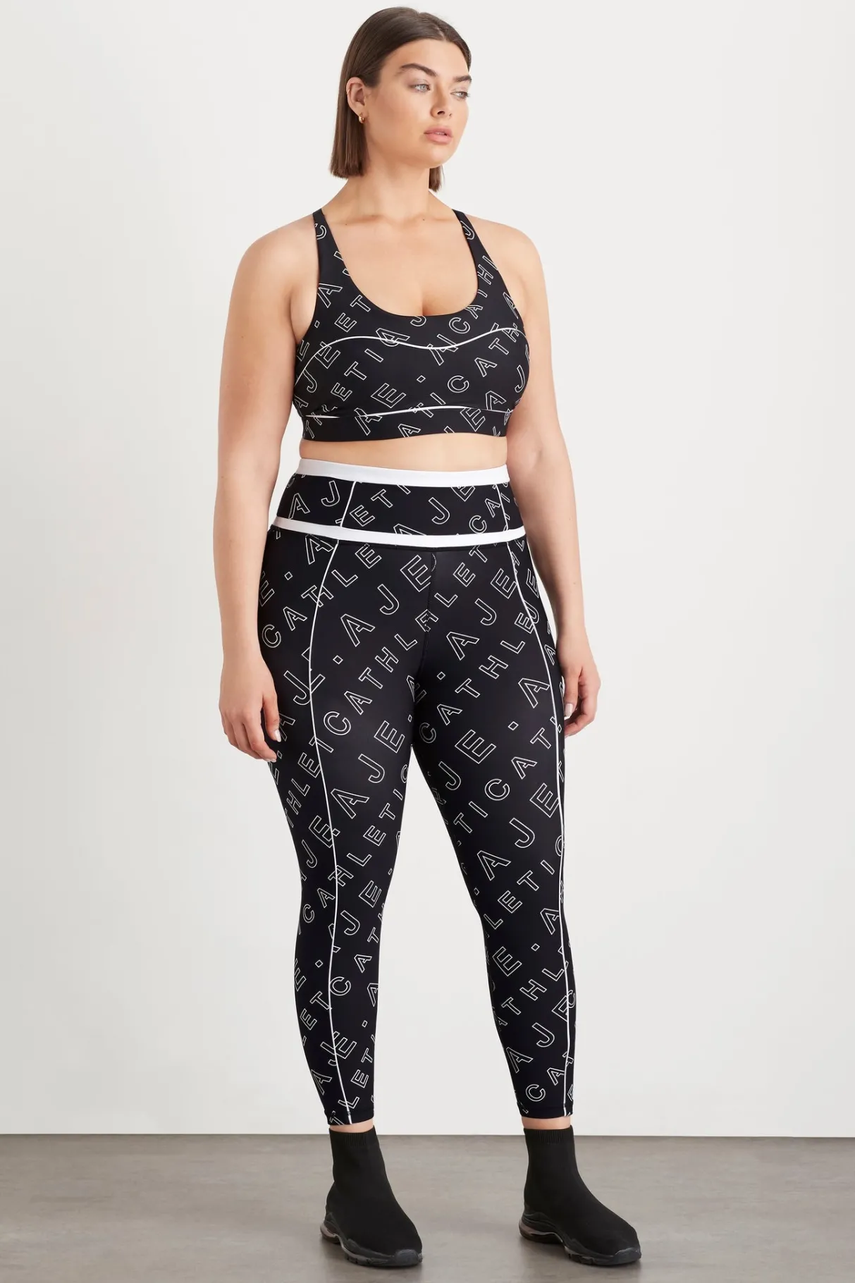 high_rise_piping__legging__11.webp New Aje ATHLETICA High Rise Piping 7/8 Legging 230 Black Fineline Logo