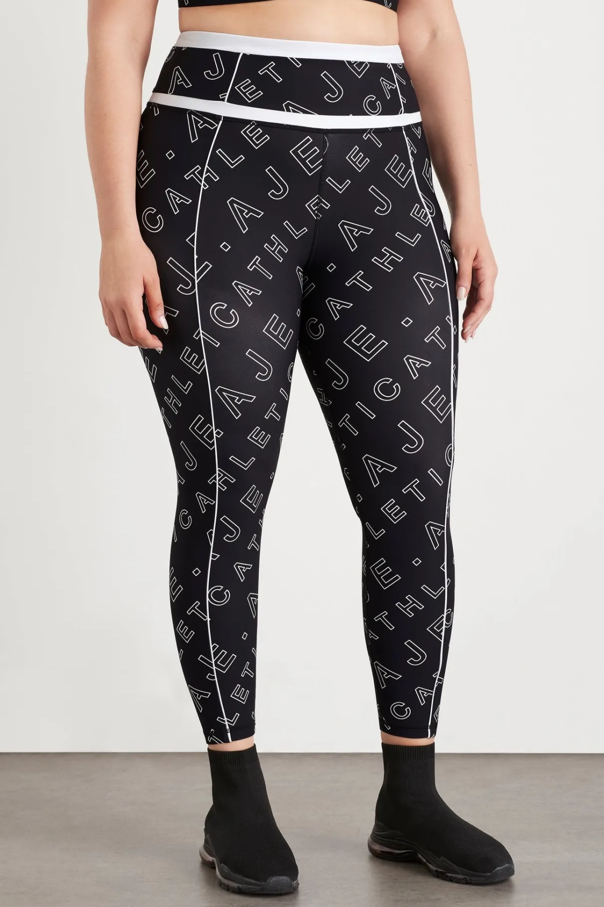 high_rise_piping__legging__12.webp New Aje ATHLETICA High Rise Piping 7/8 Legging 230 Black Fineline Logo