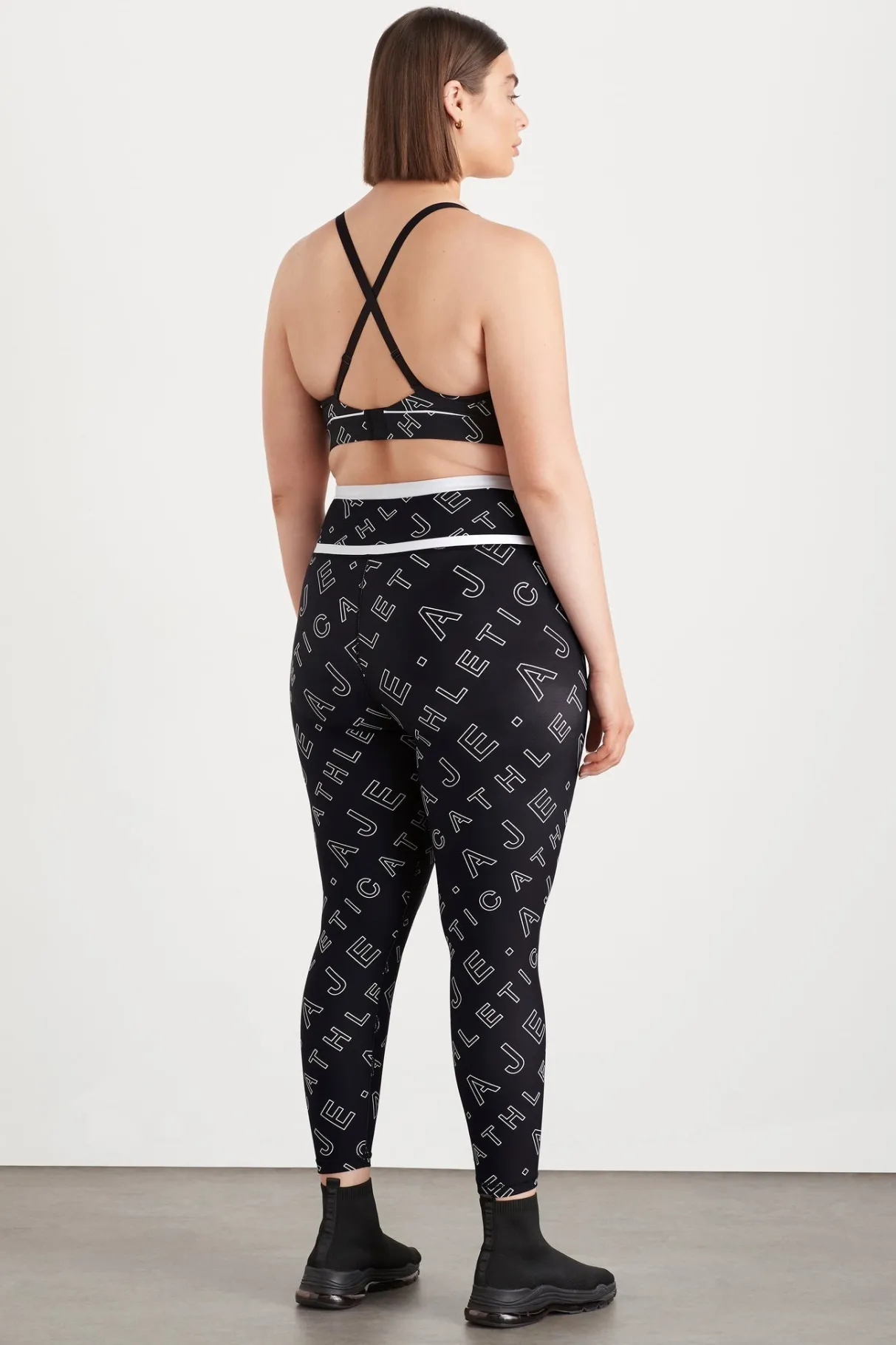 high_rise_piping__legging__14.webp New Aje ATHLETICA High Rise Piping 7/8 Legging 230 Black Fineline Logo