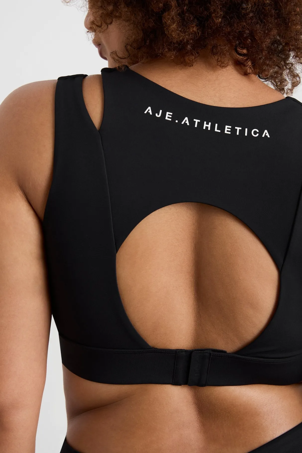 layered_cut_out_sports_bra__13.webp Store Aje ATHLETICA Layered Cut Out Sports Bra 385 Black