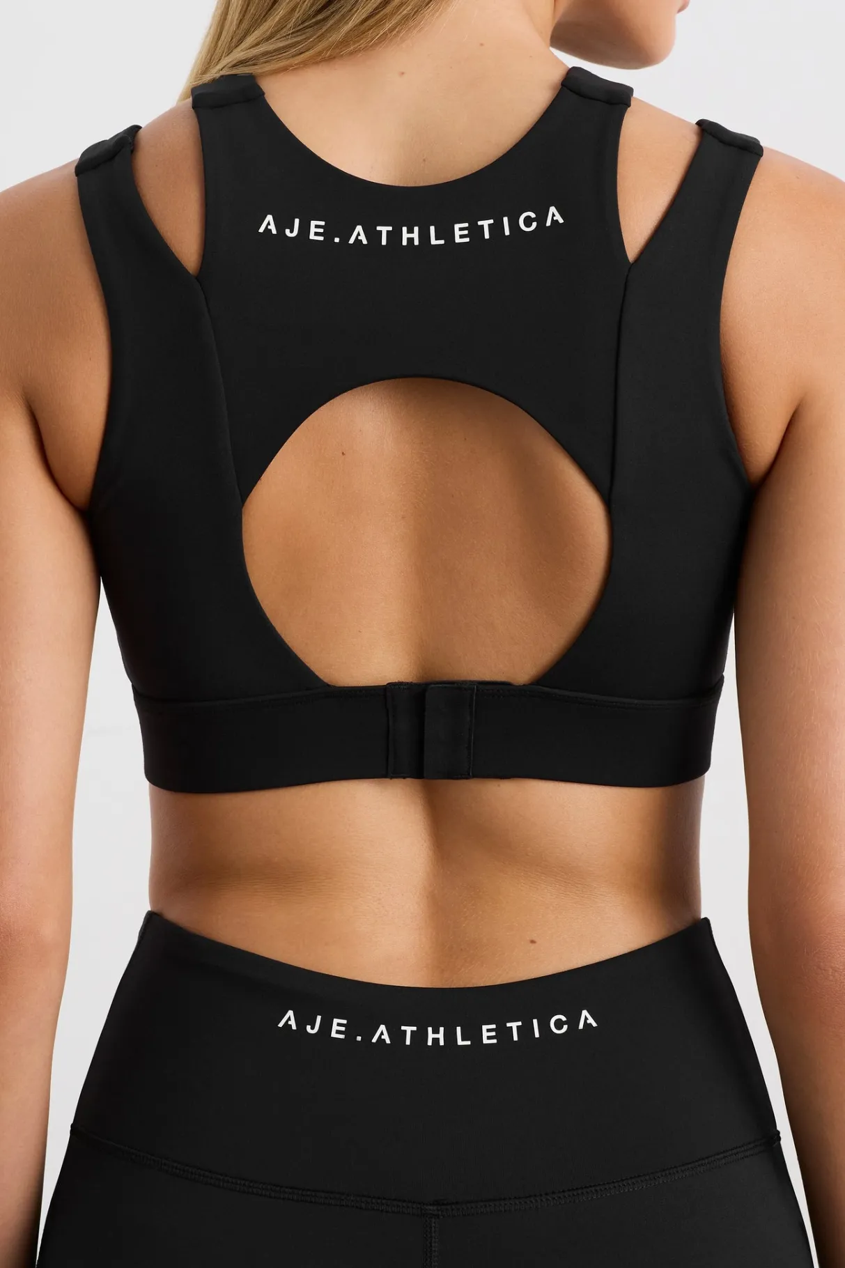 layered_cut_out_sports_bra__4.webp Store Aje ATHLETICA Layered Cut Out Sports Bra 385 Black
