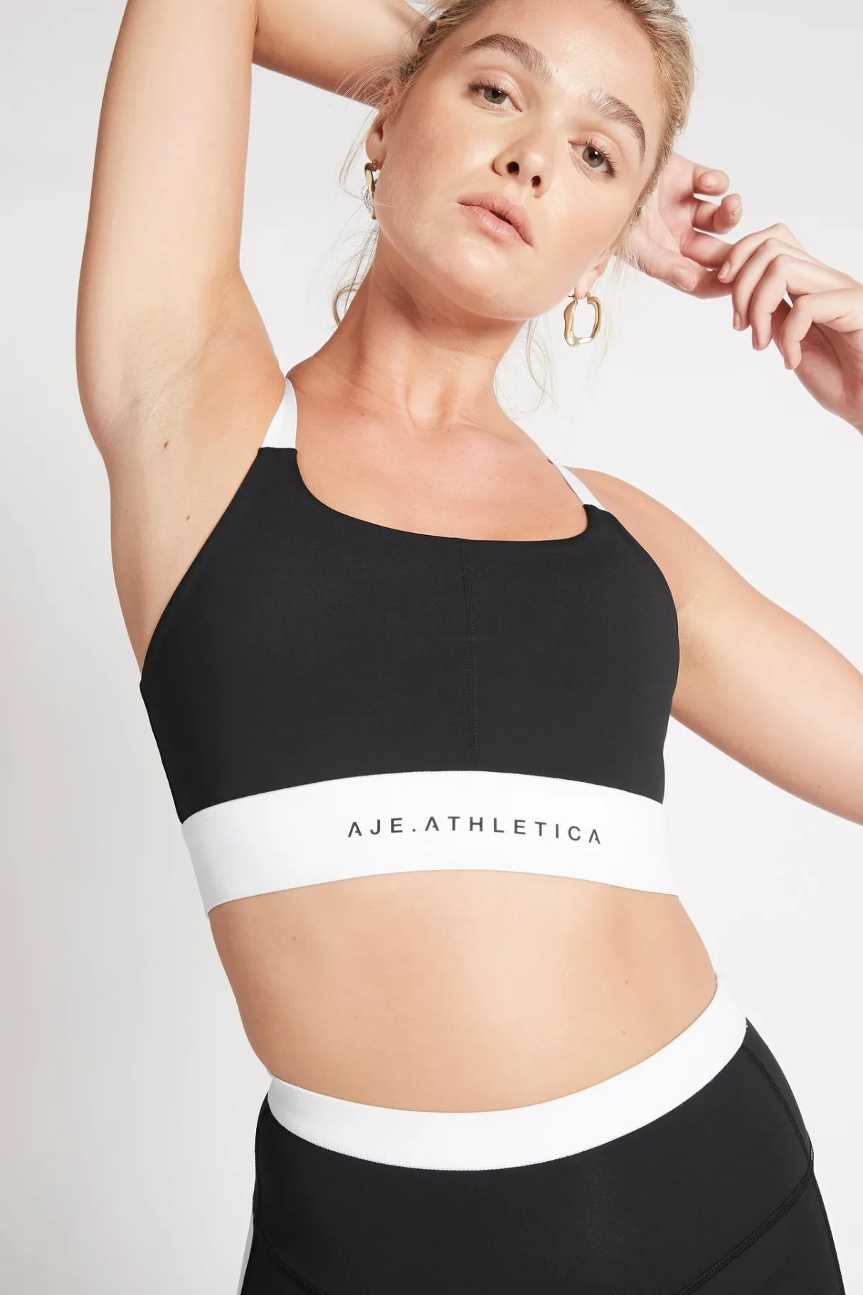 light_support_sports_bra__3.webp Discount Aje ATHLETICA Light Support Sports Bra 320 Black/White