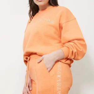 Shop Aje ATHLETICA Logo Trackpants 502 Orange Marle