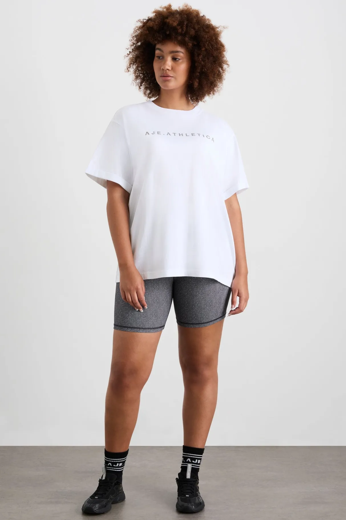 logo_tshirt__10-1.webp Shop Aje ATHLETICA Logo T-Shirt 102 White/Herringbone