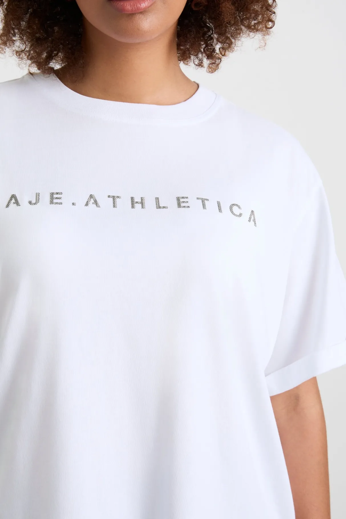 logo_tshirt__11-1.webp Shop Aje ATHLETICA Logo T-Shirt 102 White/Herringbone