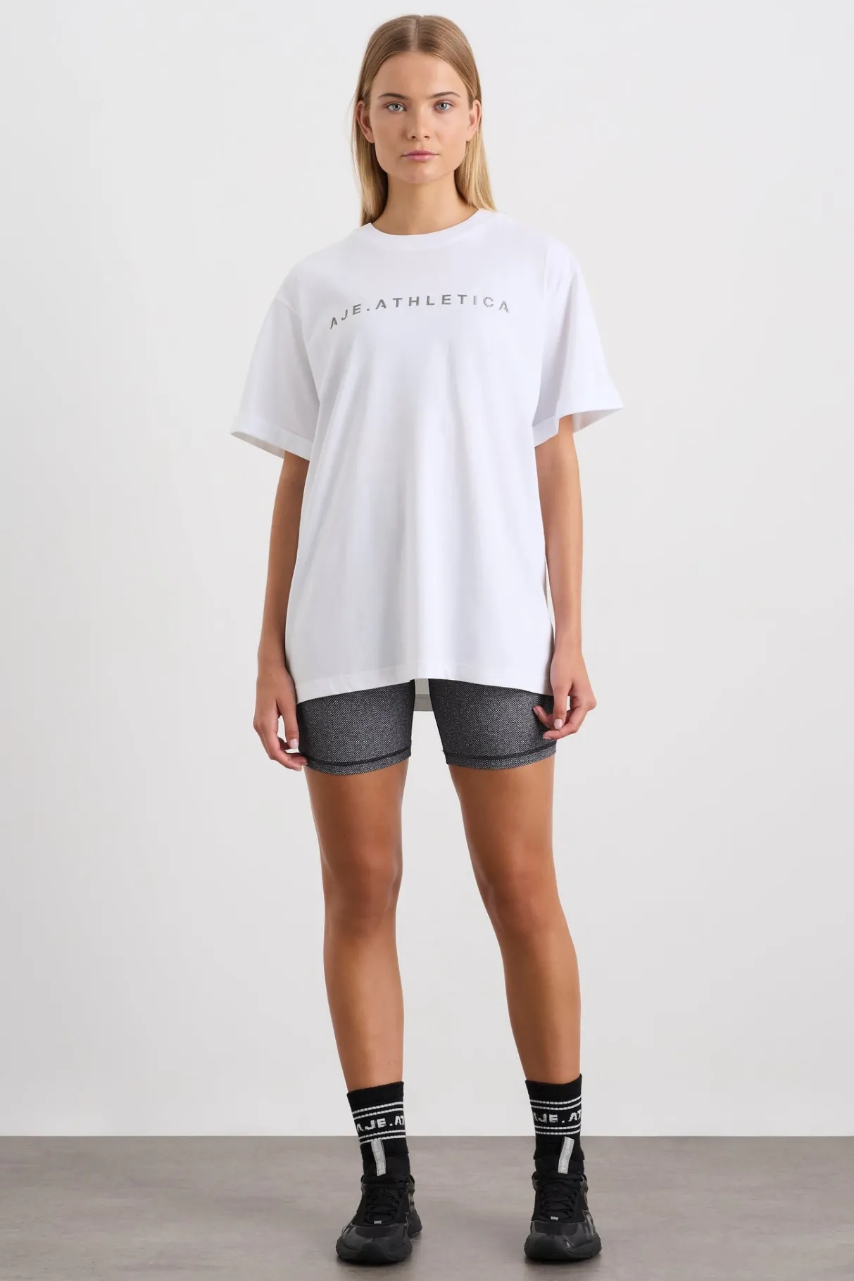 logo_tshirt__2-1.webp Shop Aje ATHLETICA Logo T-Shirt 102 White/Herringbone