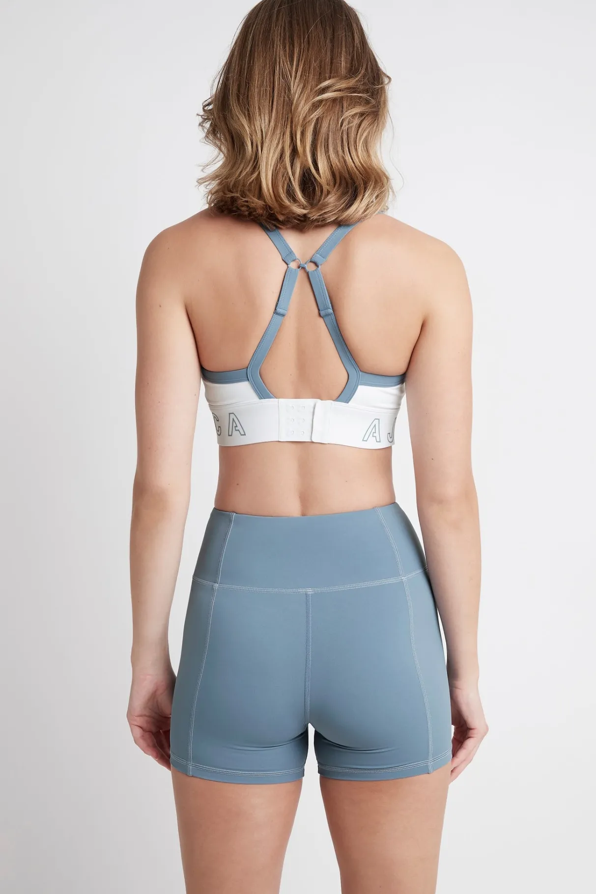 logotape_adjustable_strap_sports_bra__5-1.webp Online Aje ATHLETICA Logotape Adjustable Strap Sports Bra 307 White/Storm Blue