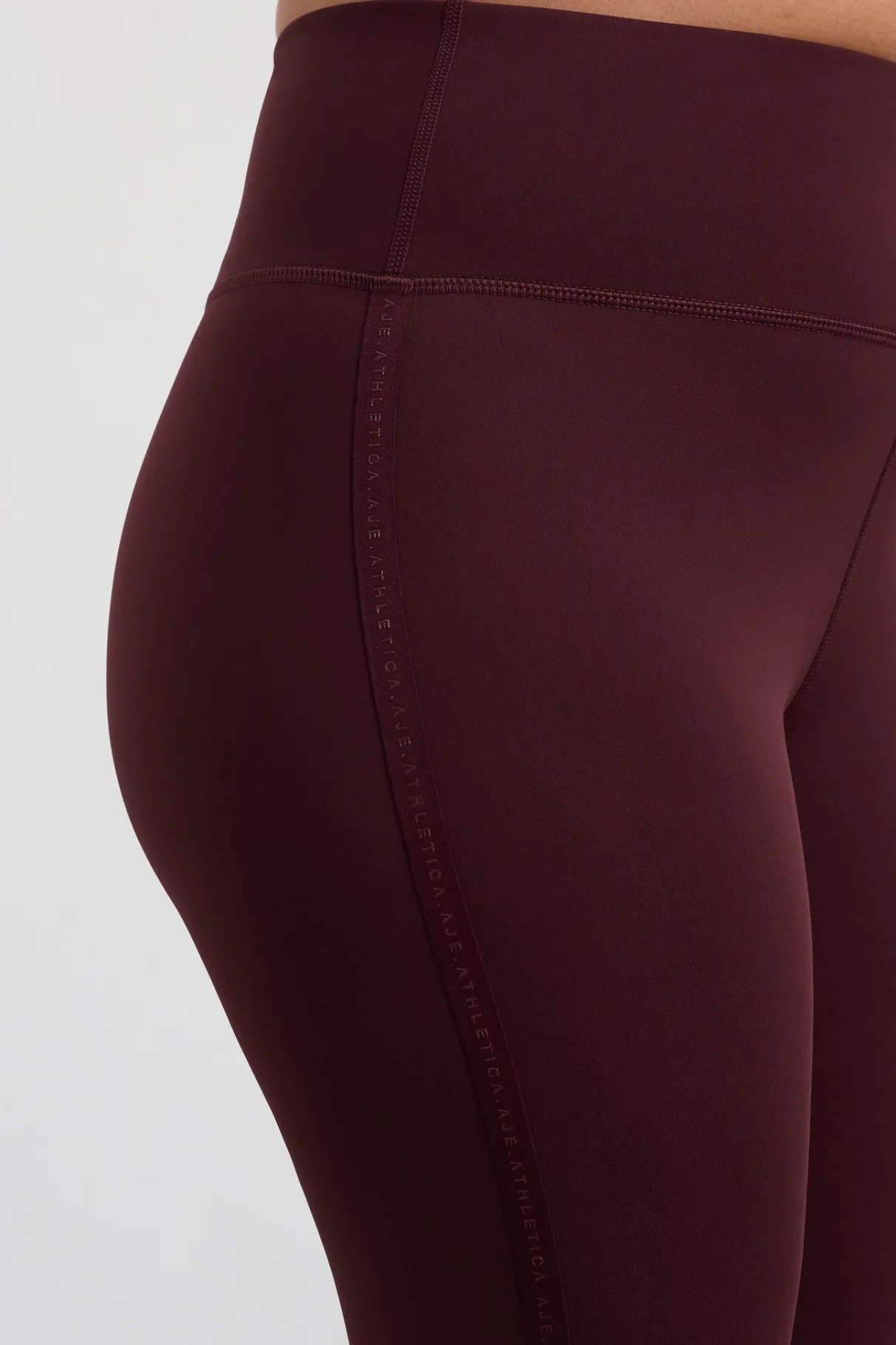 logotape_leggings__7.webp Hot Aje ATHLETICA 7/8 Logotape Leggings 203 Burgundy