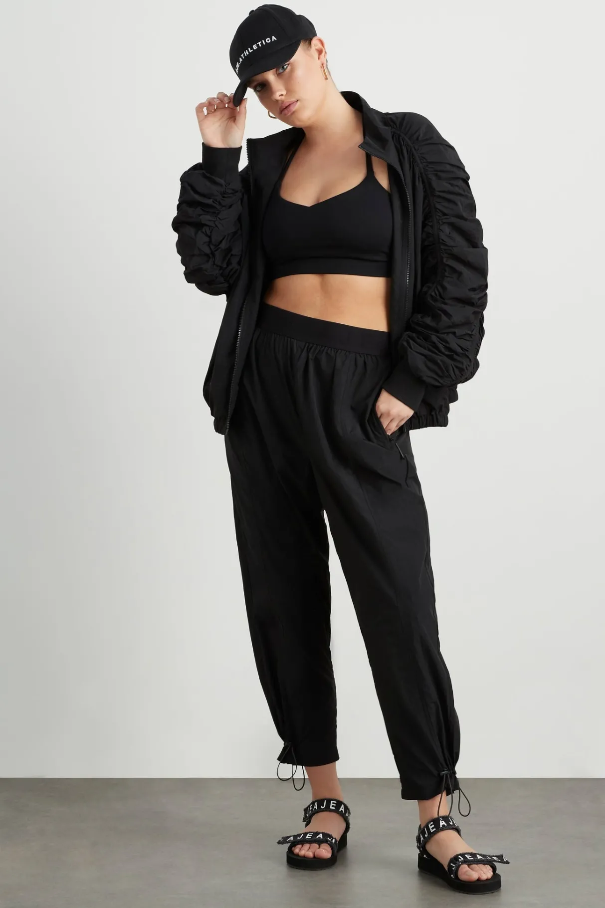 logotape_spray_trackpants__10.webp Fashion Aje ATHLETICA Logotape Spray Trackpants 511 Black